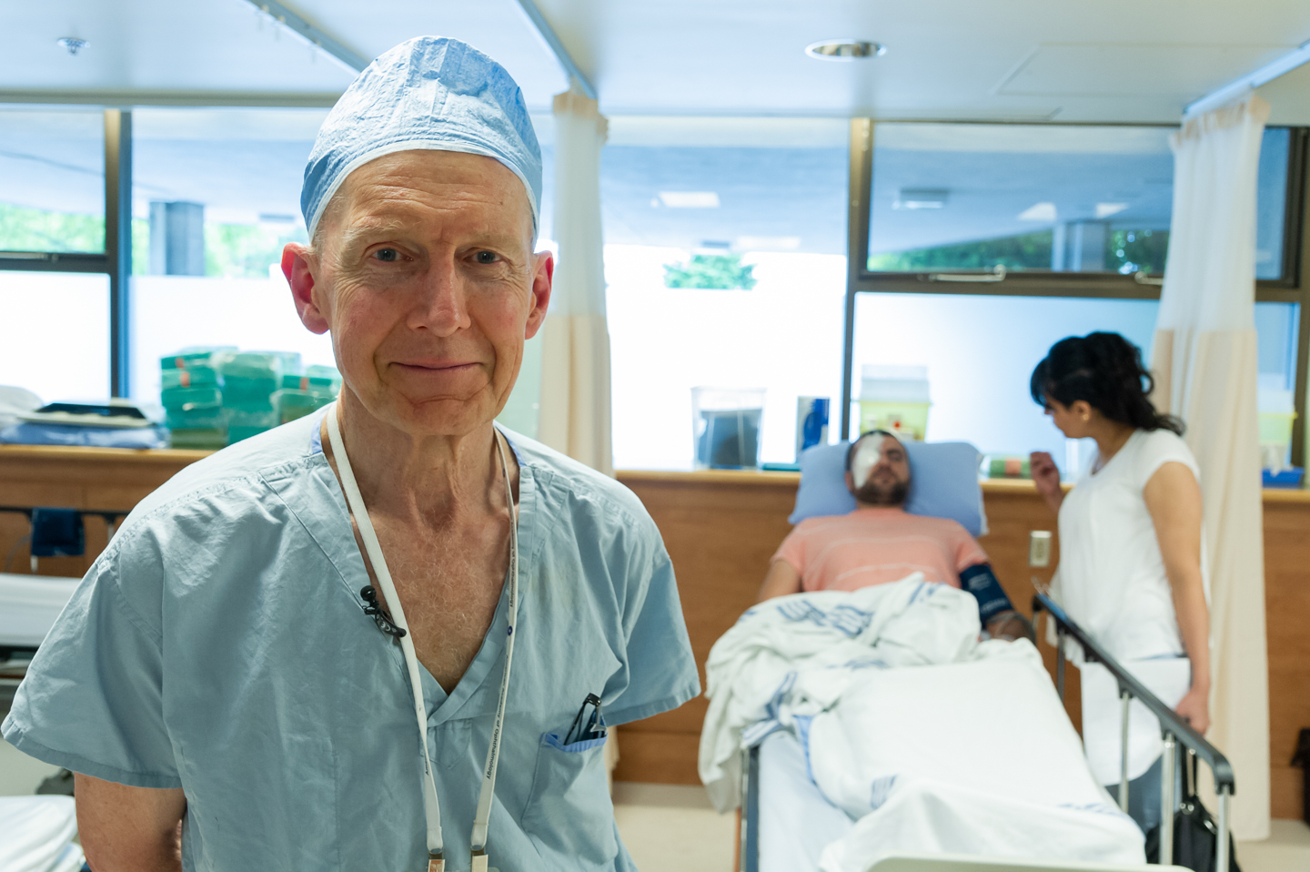 Image of Dr. Simon Holland with Anas Schichmouse and his sister after his cornea transplant surgery.