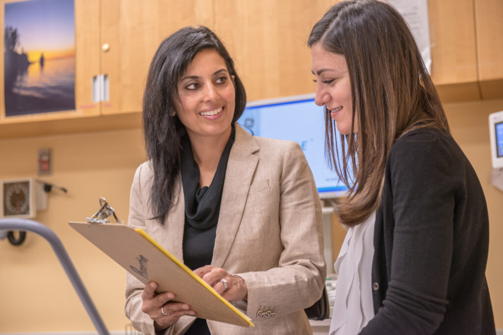 Image of Dr. Jasmine Grewal with a PACH patient