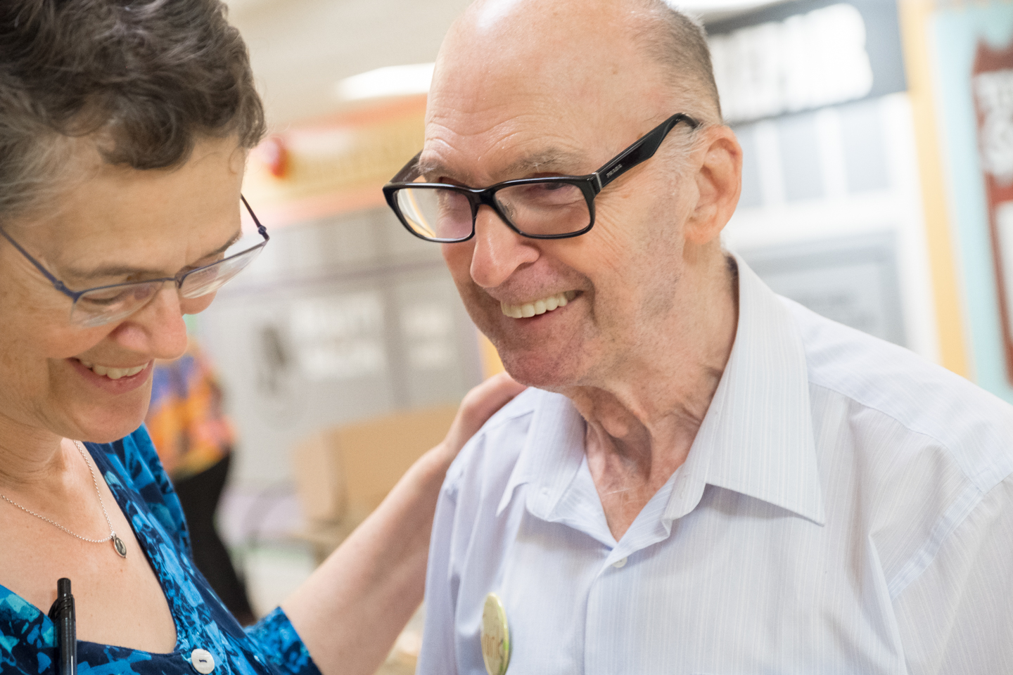 Frank, attendee of Youville's Adult Day program, smiles during music therapy.