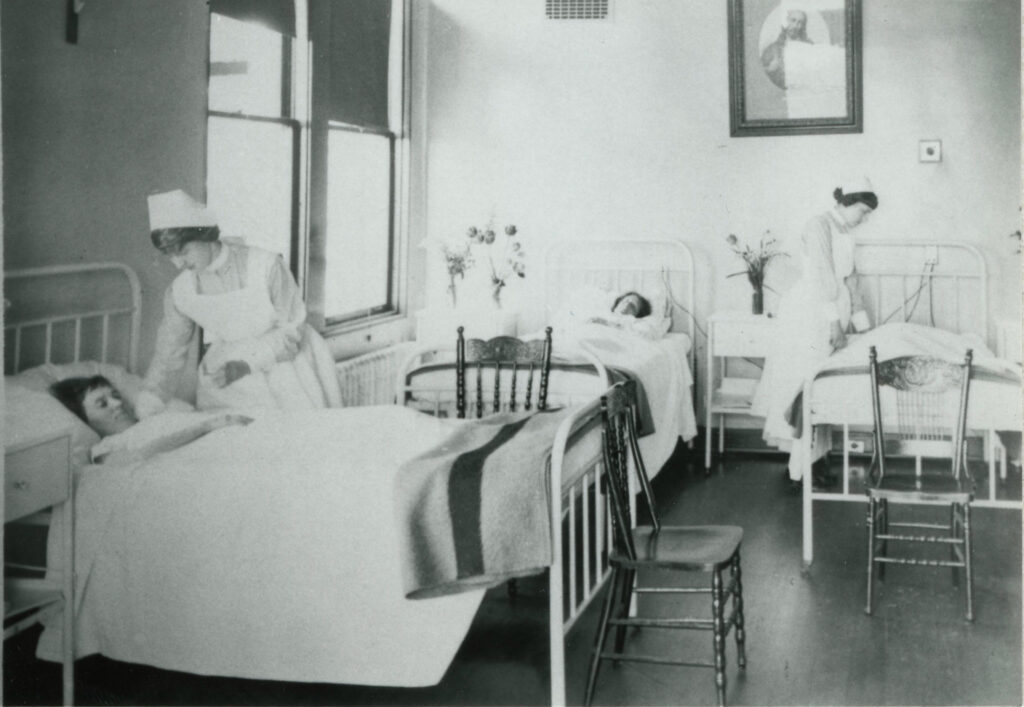 Student nurses tending to patients at St. Paul's Hospital in 1919.